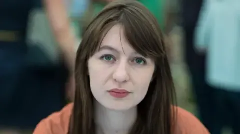 The acclaimed novelist declares she will not travel to the UK due to arrest fears